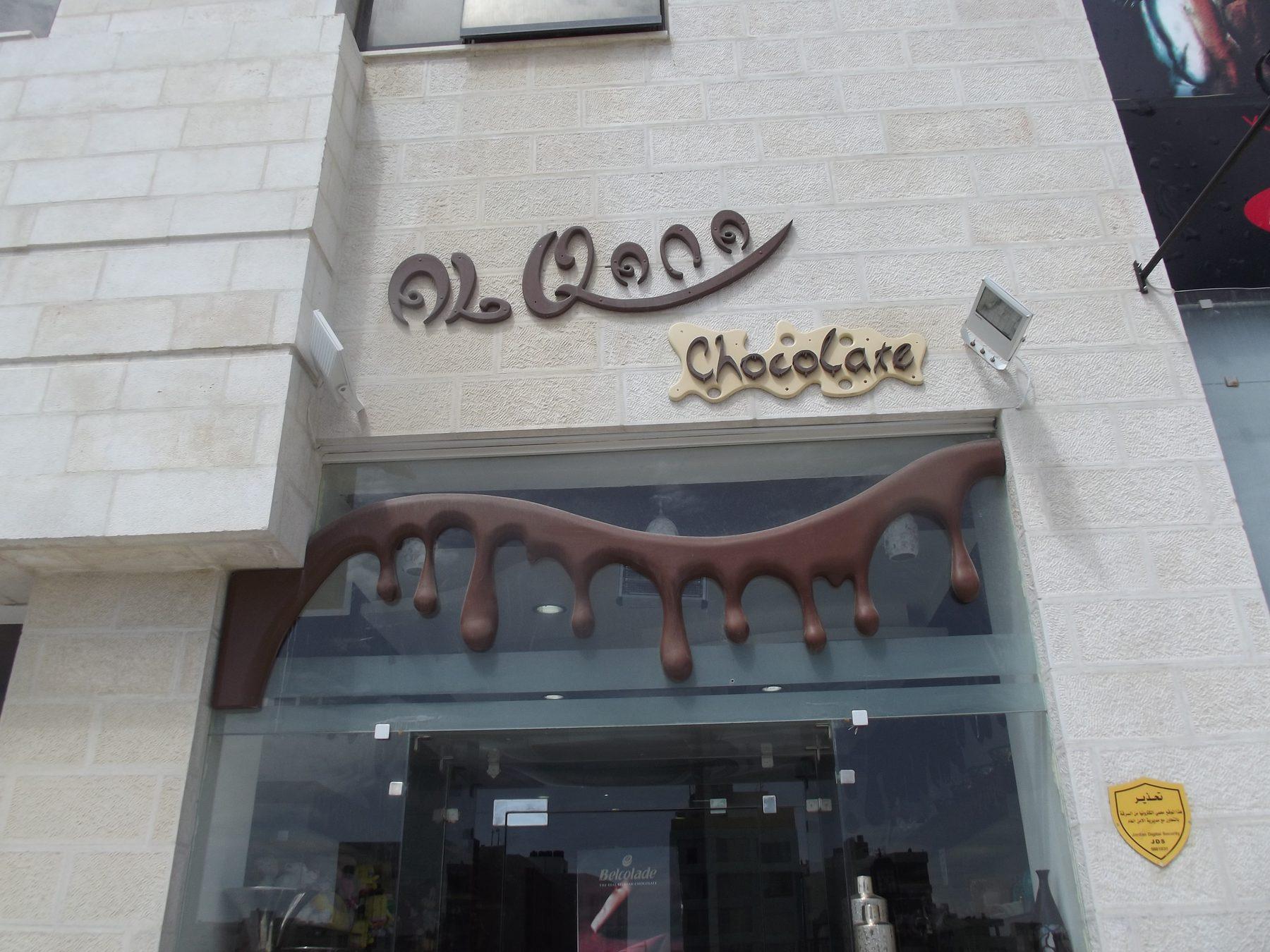Shopfront with lettering and chocolate-drip graphic over the glazing