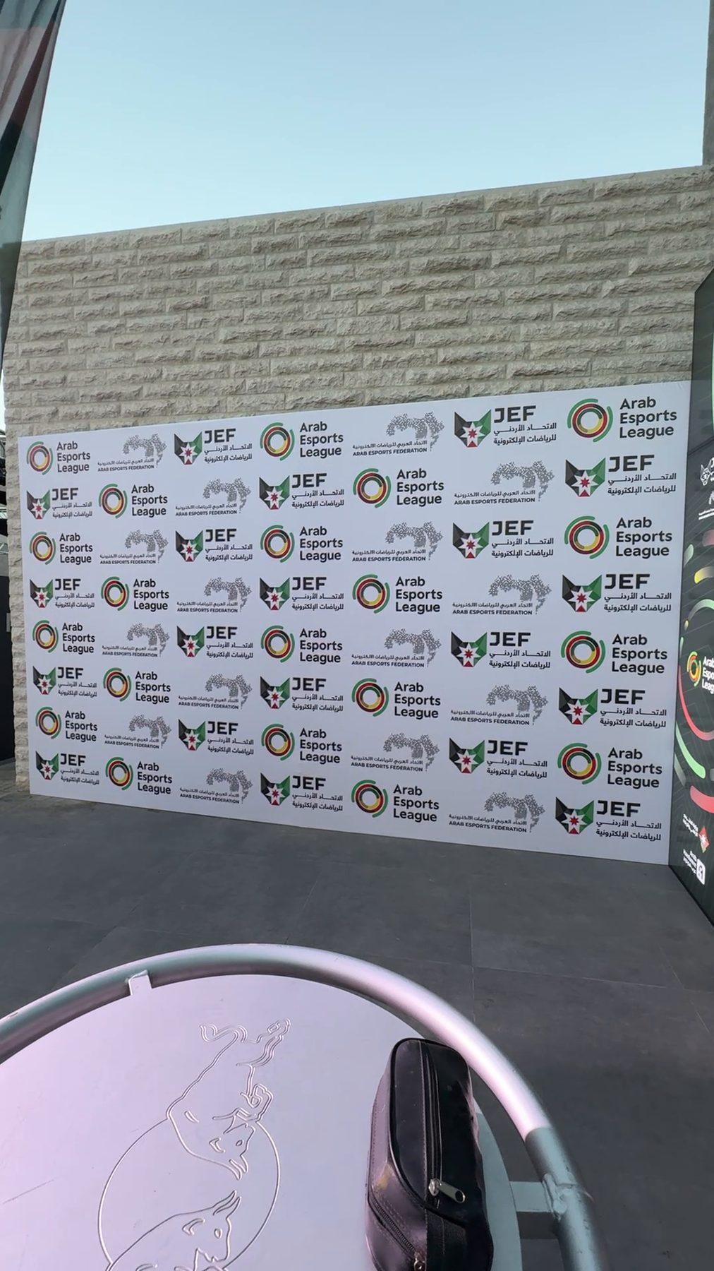 Step-and-repeat media wall with the league and federation logos.