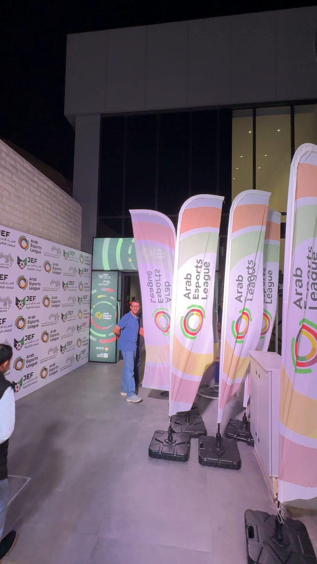 Feather flags with the league logo outside the venue.