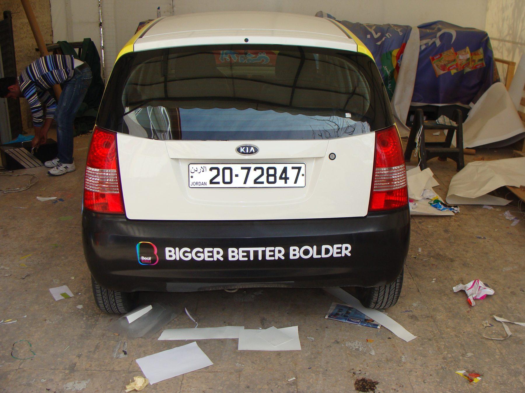 Rear view with a bumper graphic reading Bigger Better Bolder