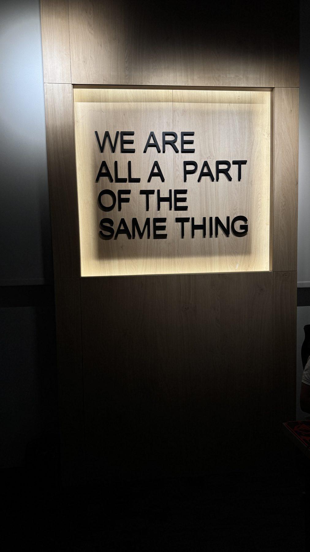 The backlit wall slogan.