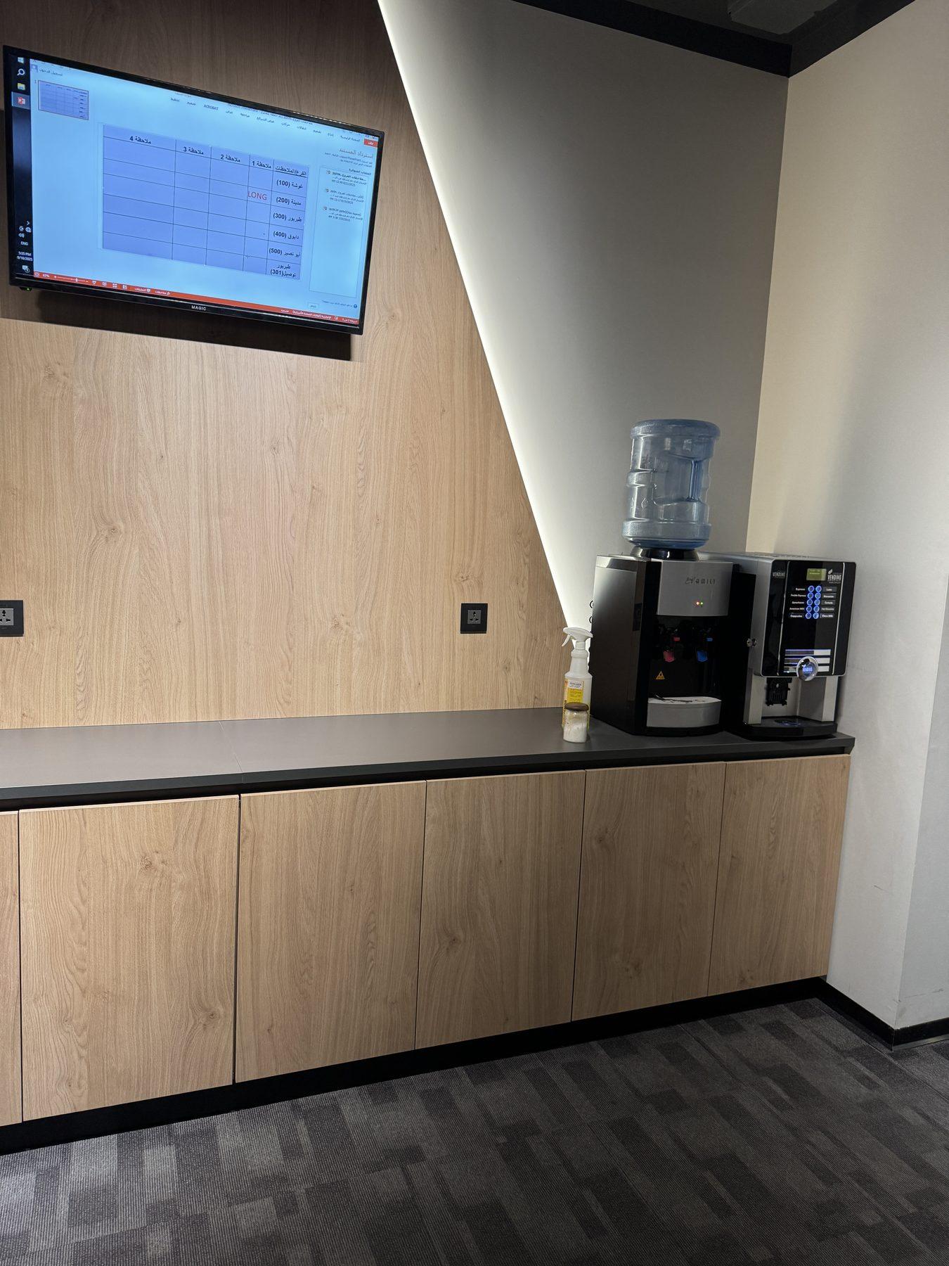 The kitchenette with wood-veneer cabinets.