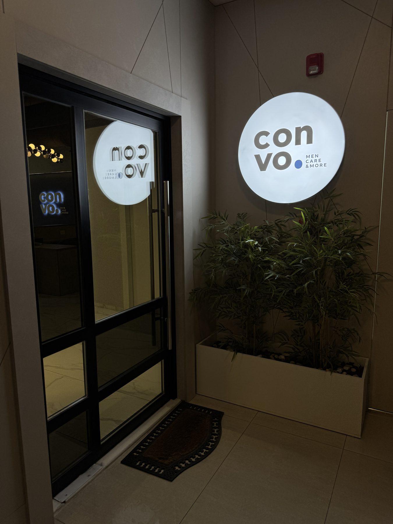 Round lit logo signs at the entrance.