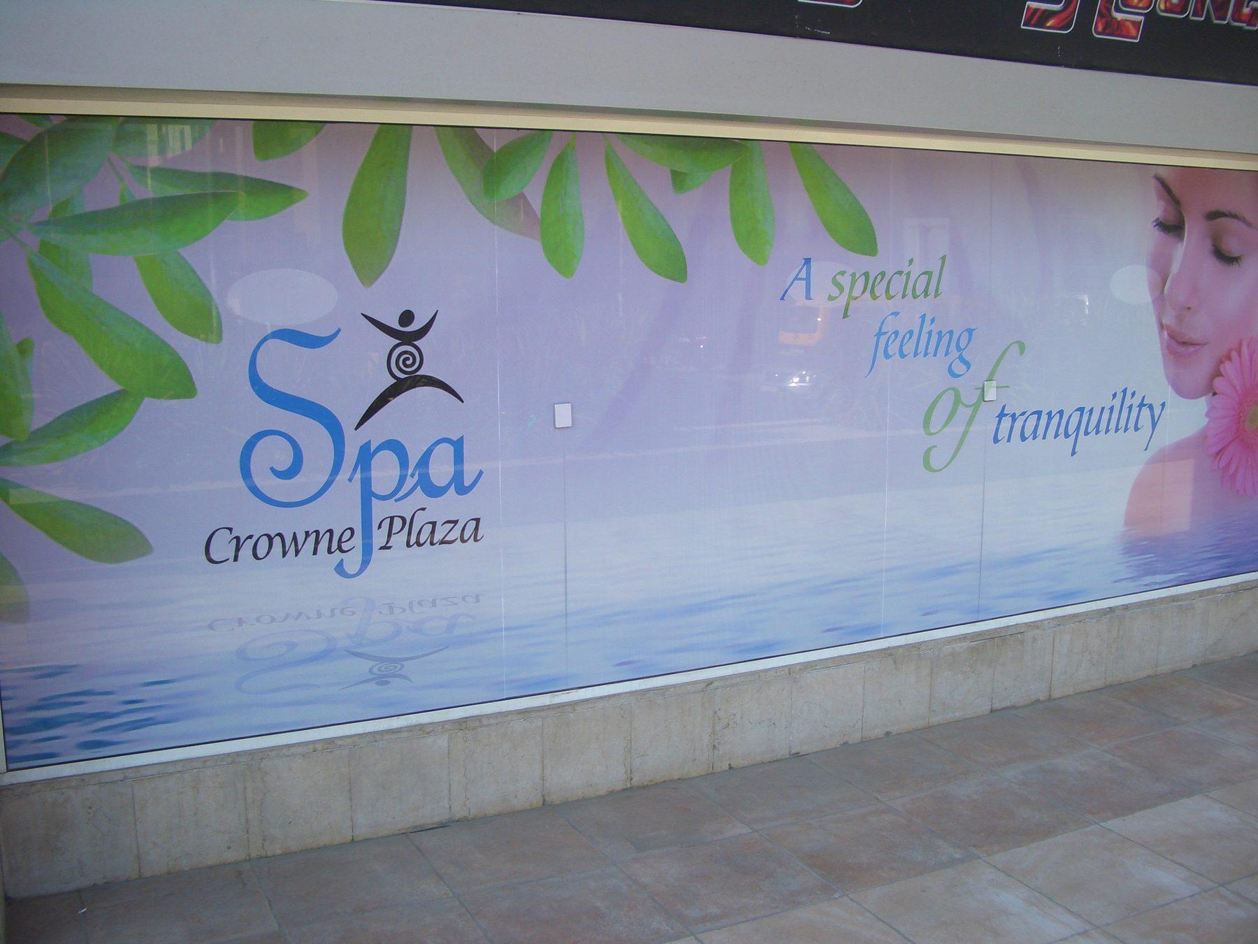 Printed wall banner with floral artwork and spa logo
