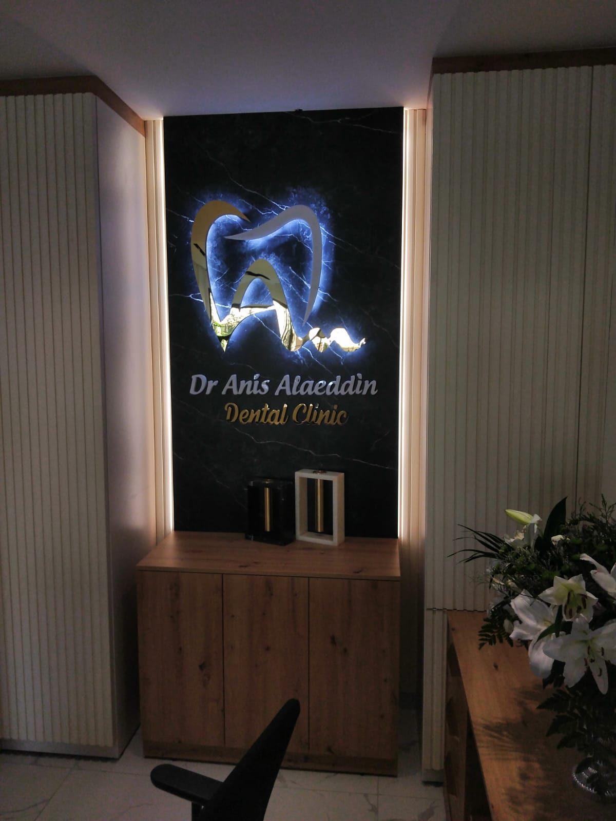 Backlit dimensional logo on a dark marble-effect wall