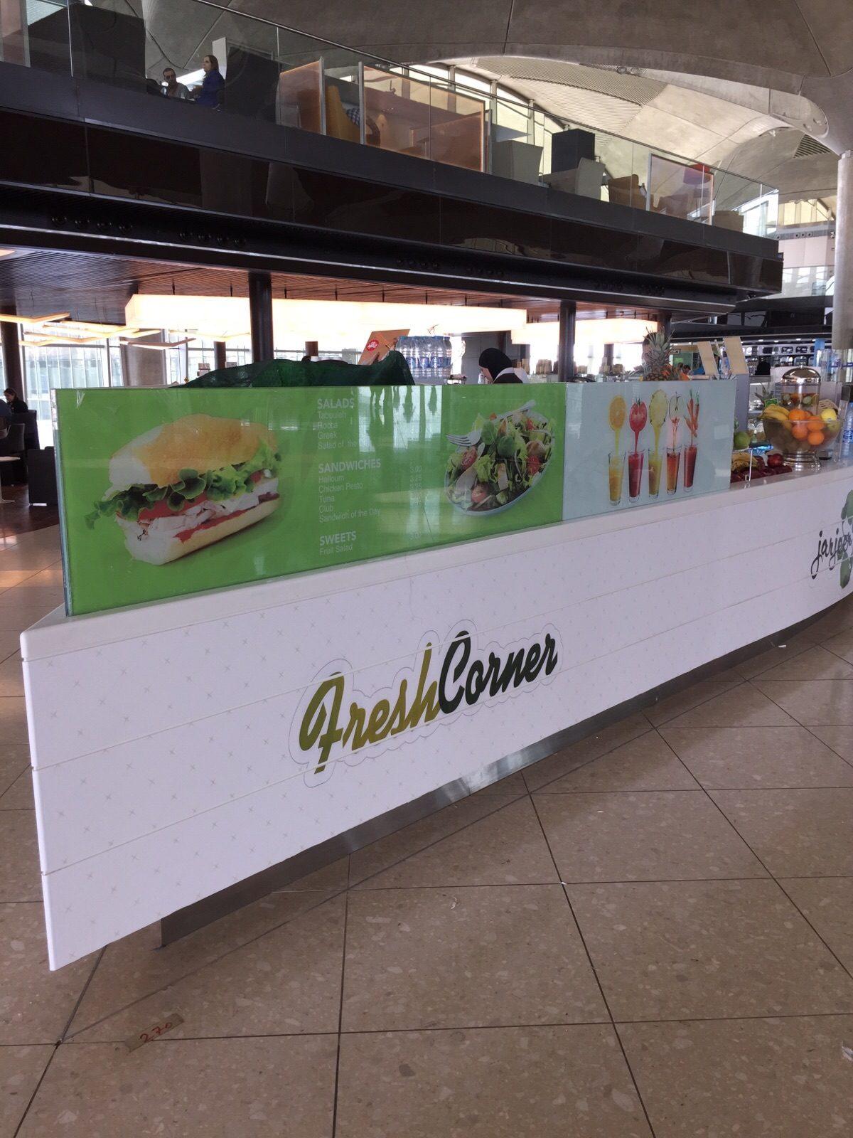 White counter with logo and sandwich graphics
