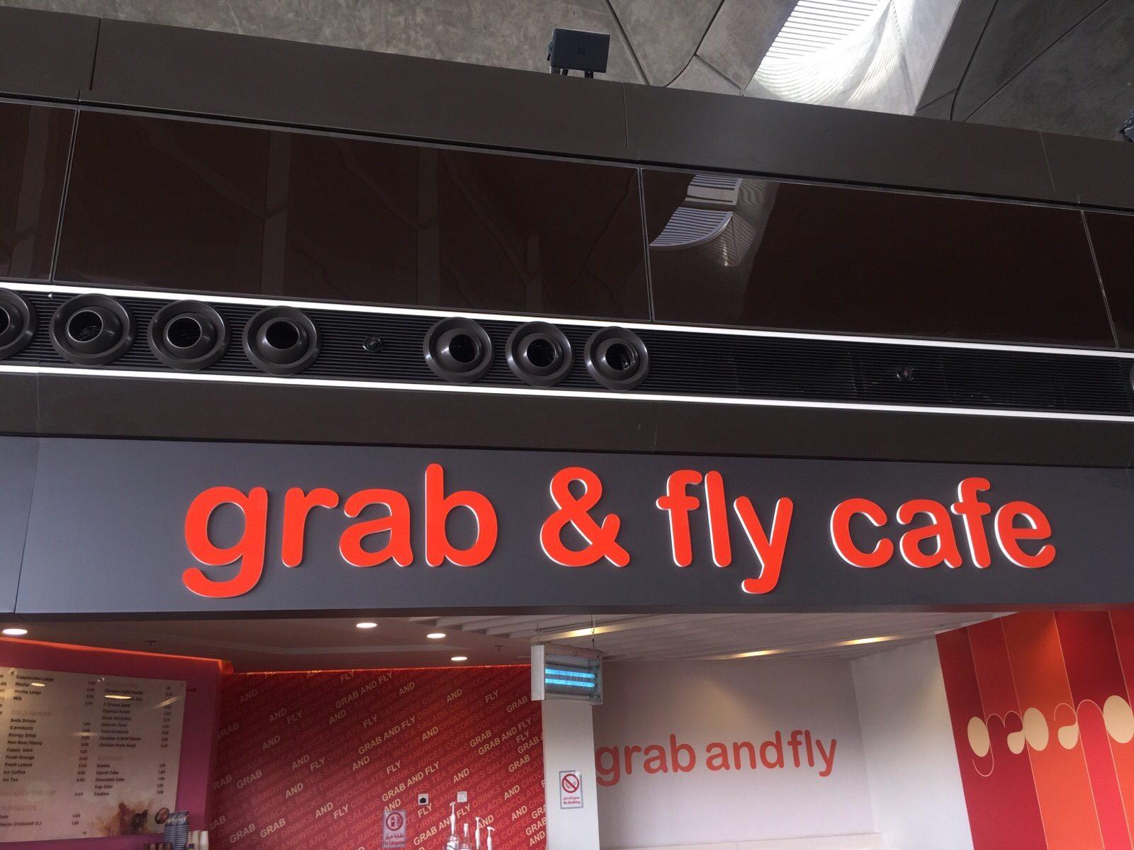 Glowing red channel letters mounted on the ceiling above the entrance.