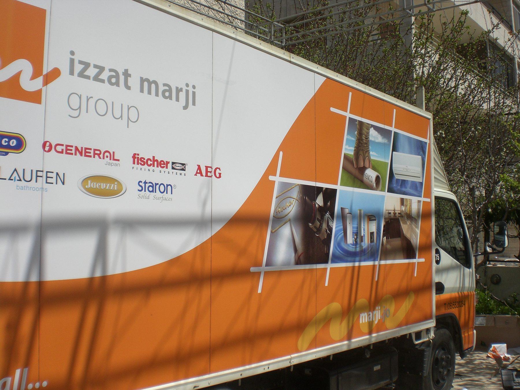 Box truck side with a logo lockup of brand names and product photos