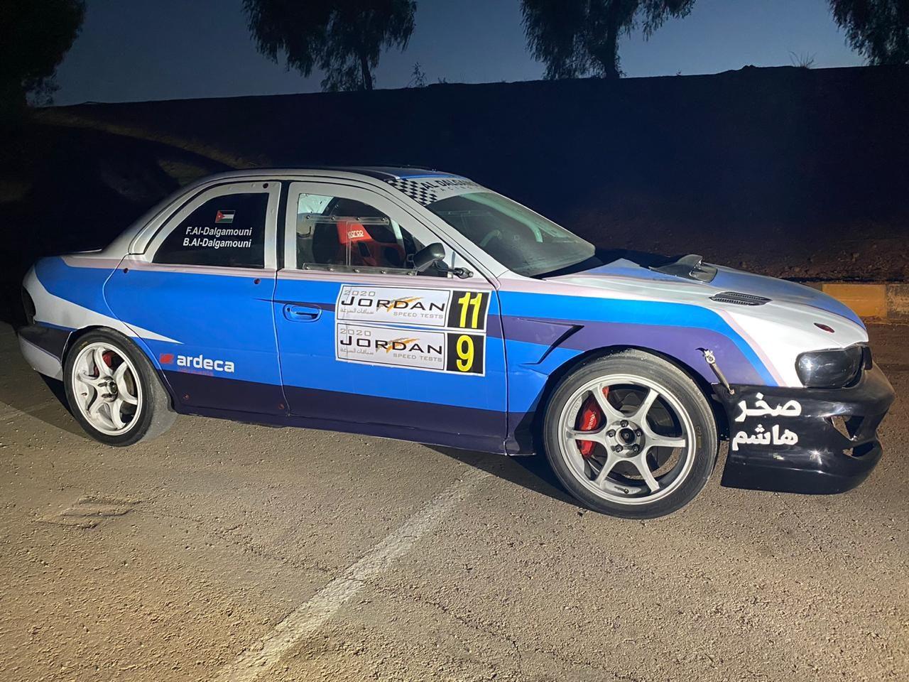 Rally car with side decals and race-number graphics
