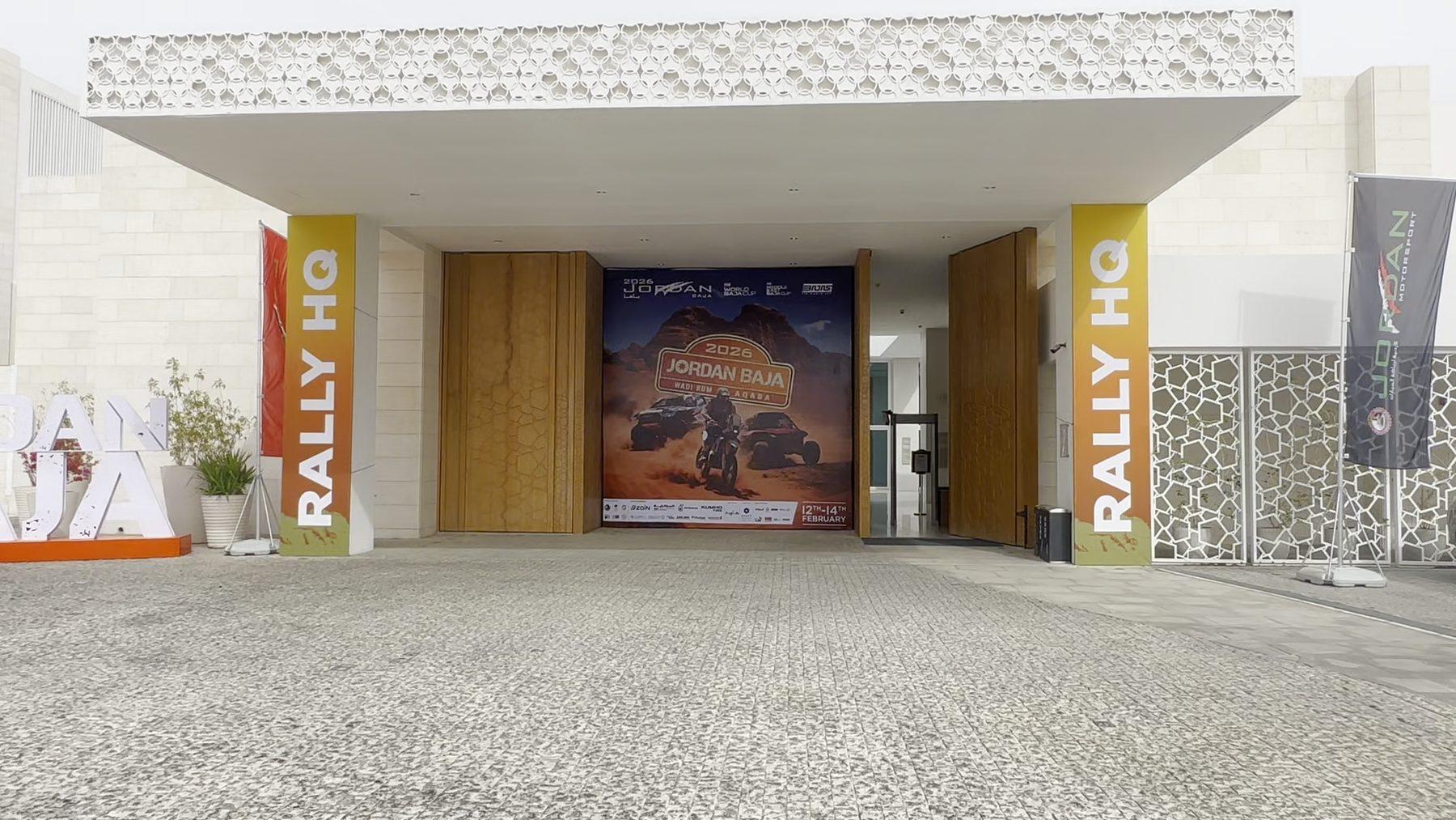 The Rally HQ entrance with branded pillars and the event backdrop.