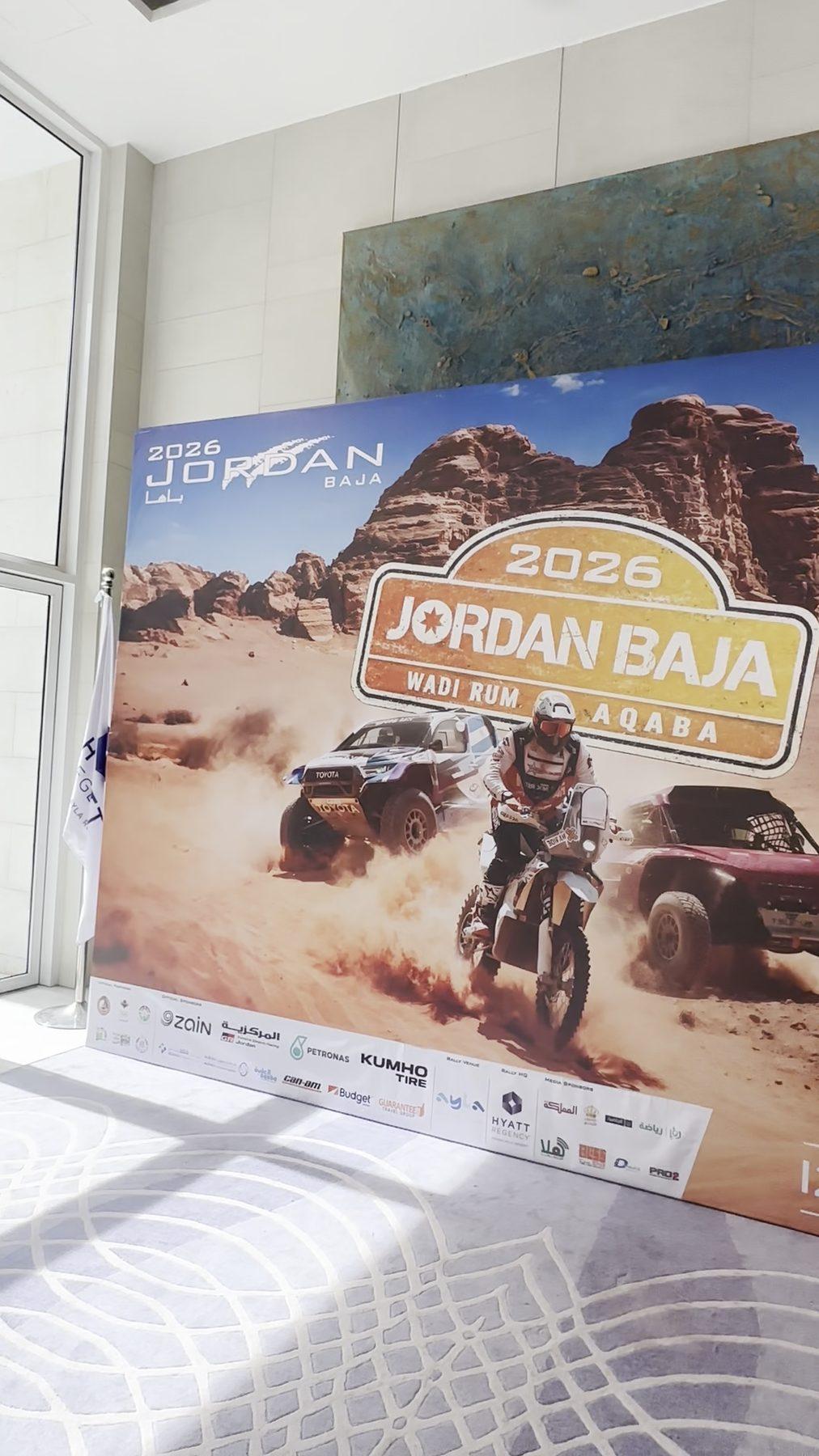 The event poster mounted indoors.