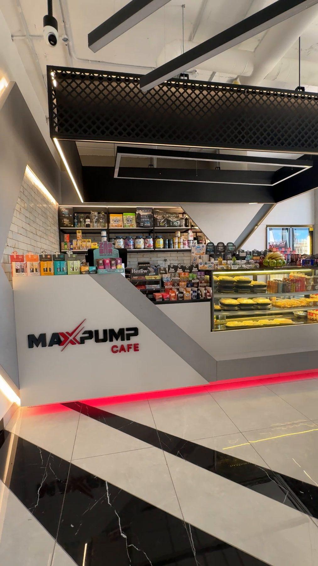 The café counter with the Max Pump Café logo.