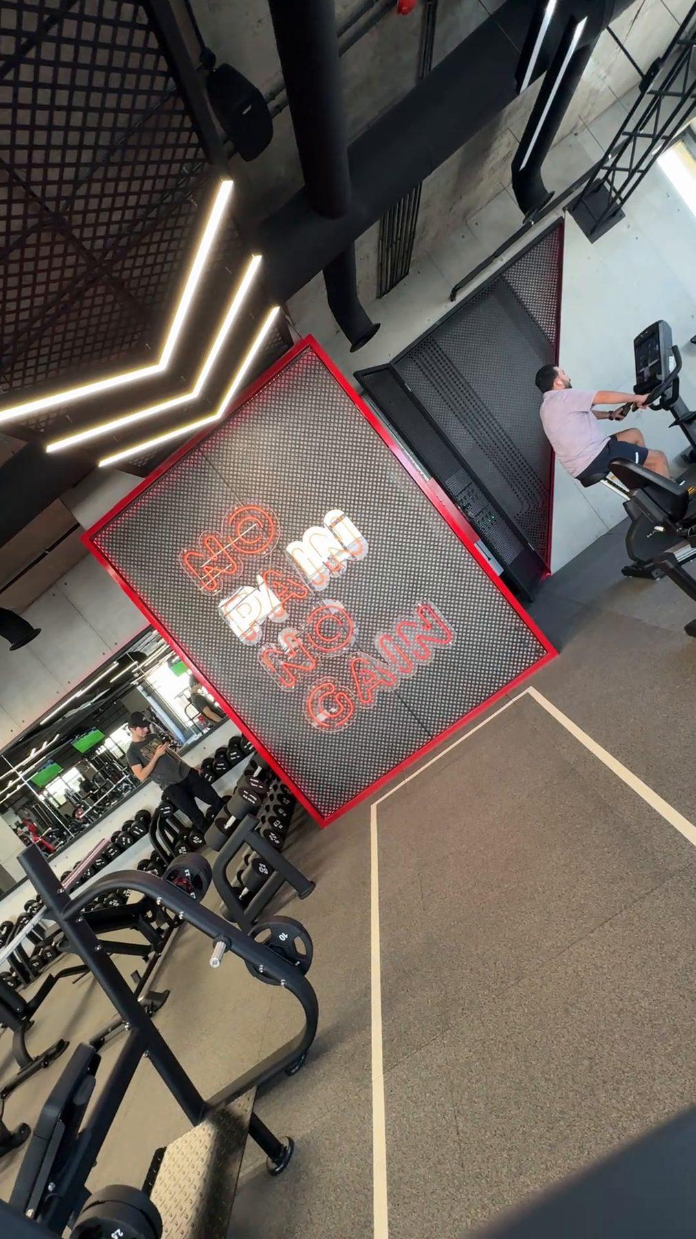 A motivational wall graphic at the end of the cardio track.