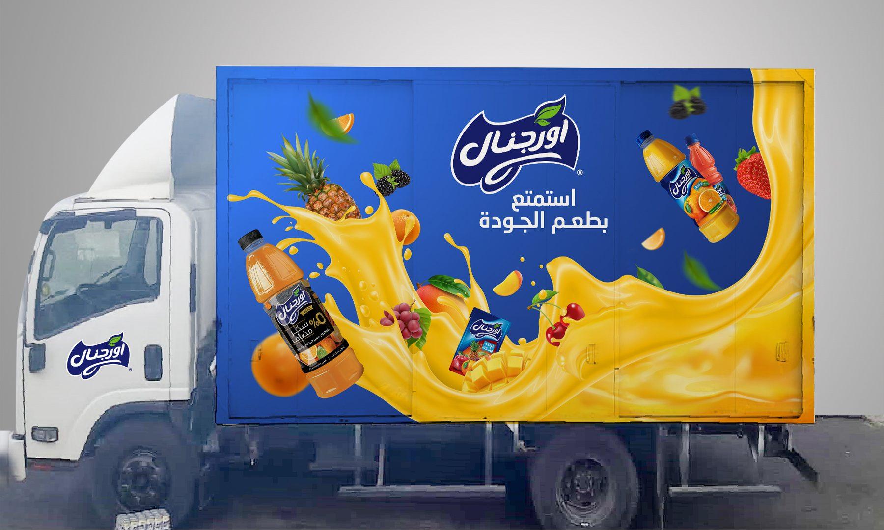 Box truck with blue side wrap, juice bottles, fruit and an orange splash