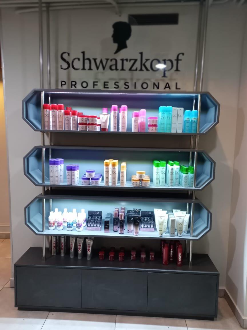 Three-tier lit display with products on each shelf