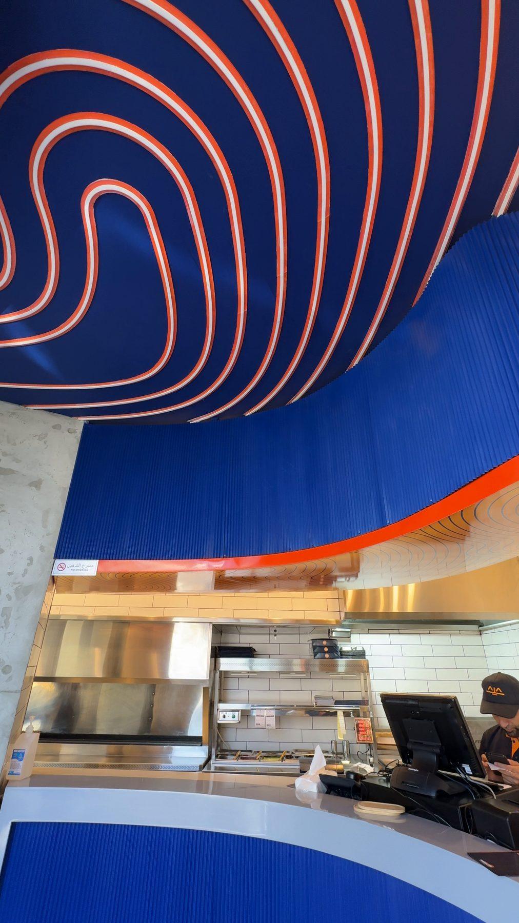 The curved slatted ceiling above the counter.