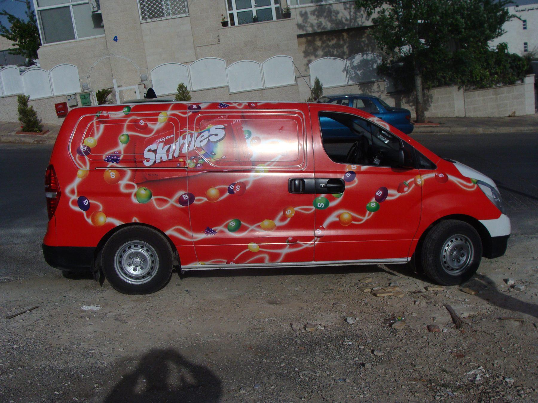 Red van side panels with candy artwork and Skittles lettering