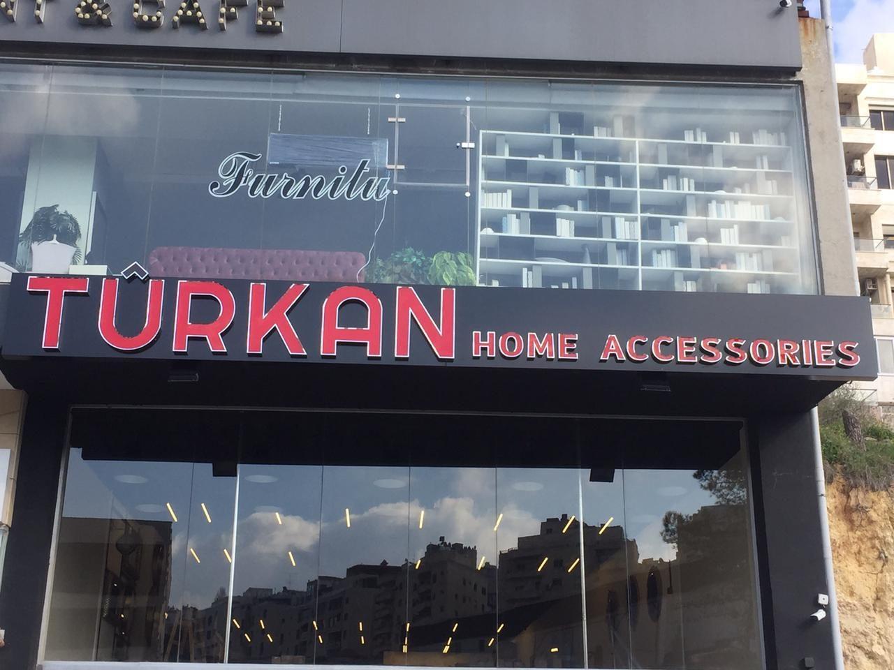 Fascia above a glazed shopfront in daylight