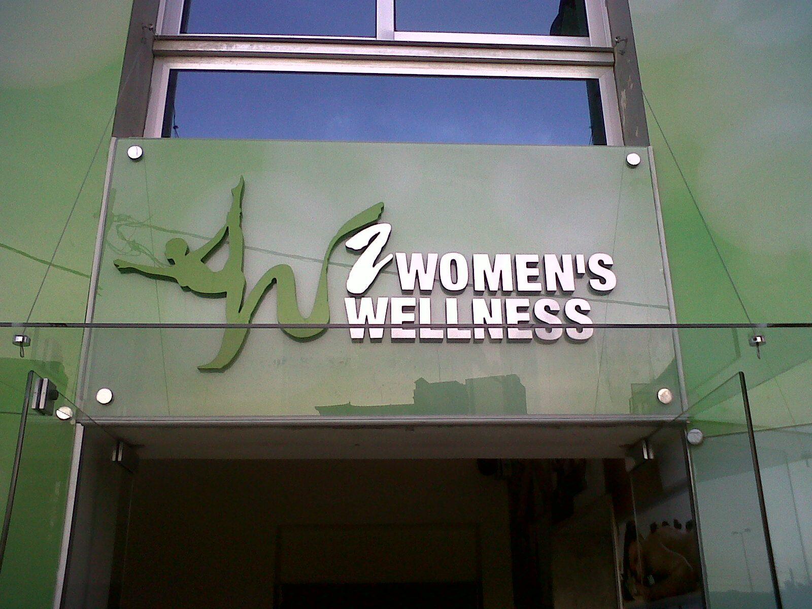 Dimensional logo letters on a glass panel above the entrance