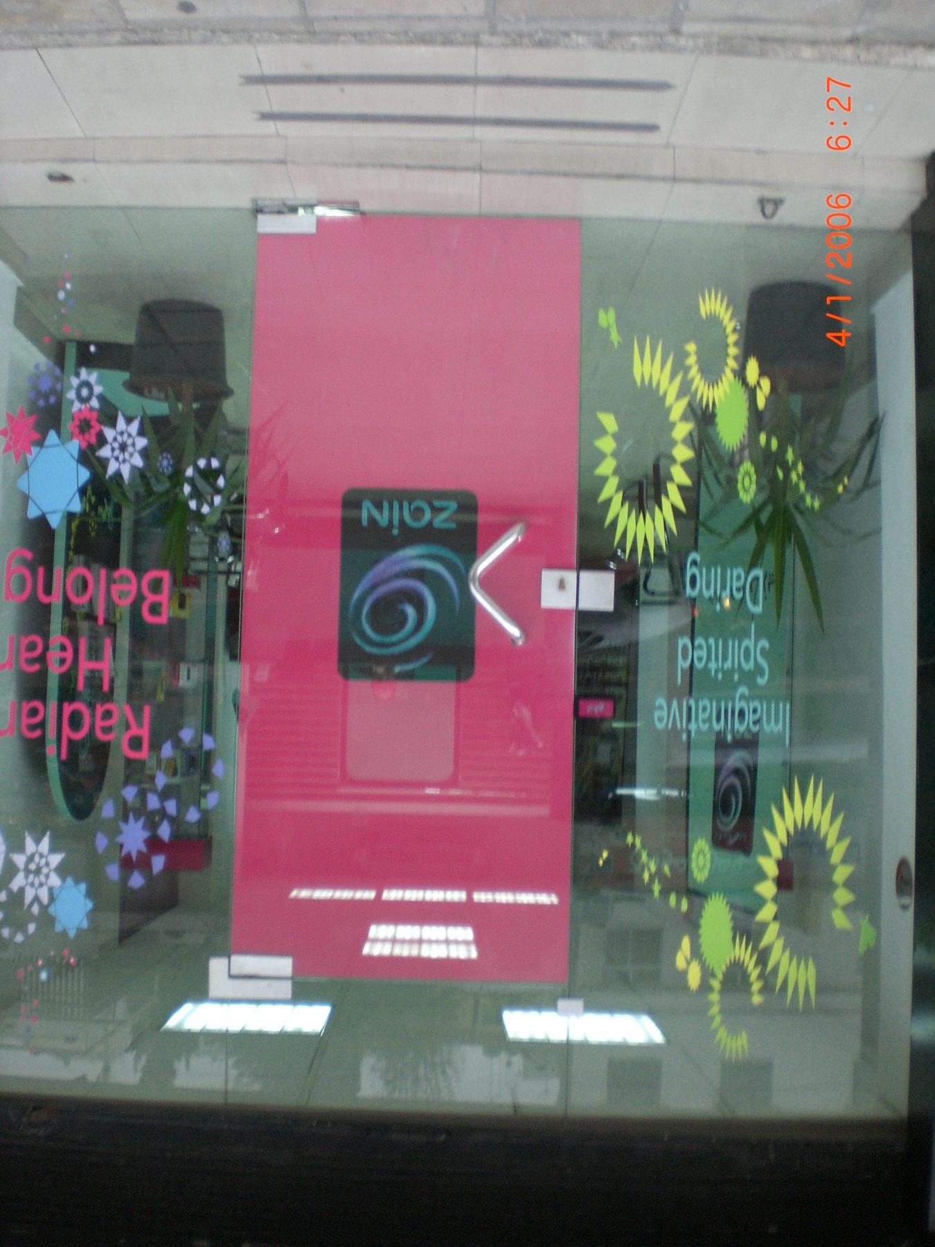 Pink door panel with floral vinyl graphics on the glazing