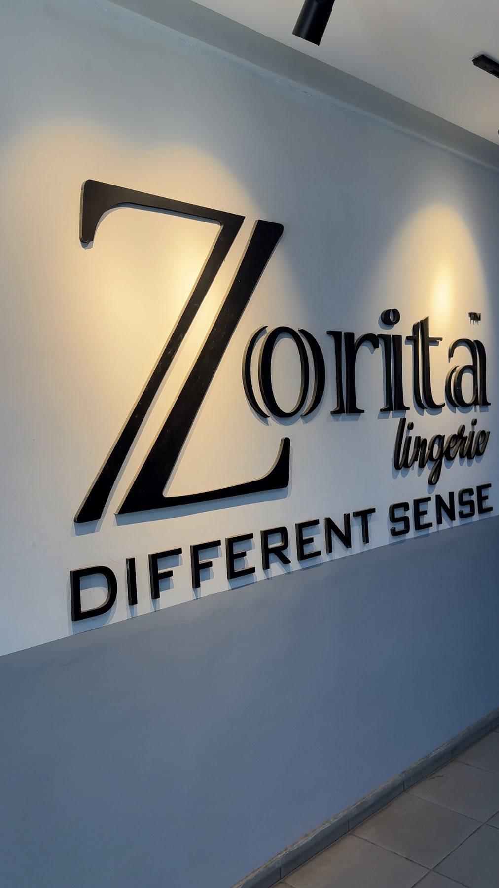 The raised Zorita Lingerie logo on the interior wall.