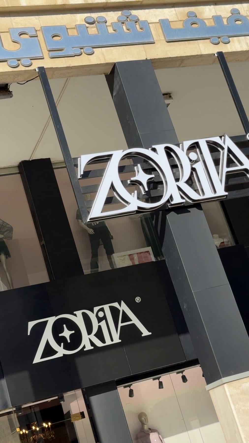 The projecting sign and the fascia from the street.