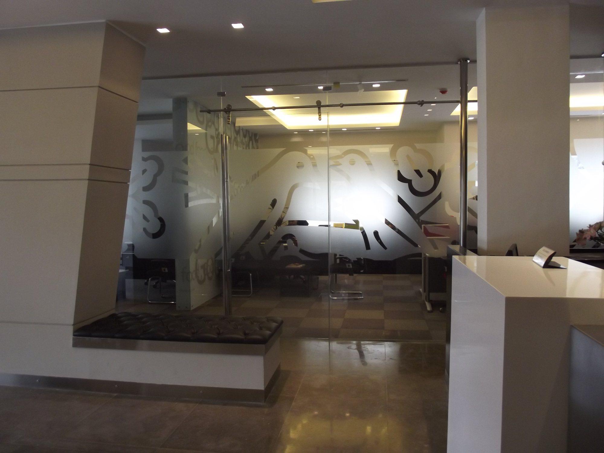 Frosted film with a cut pattern on office glazing